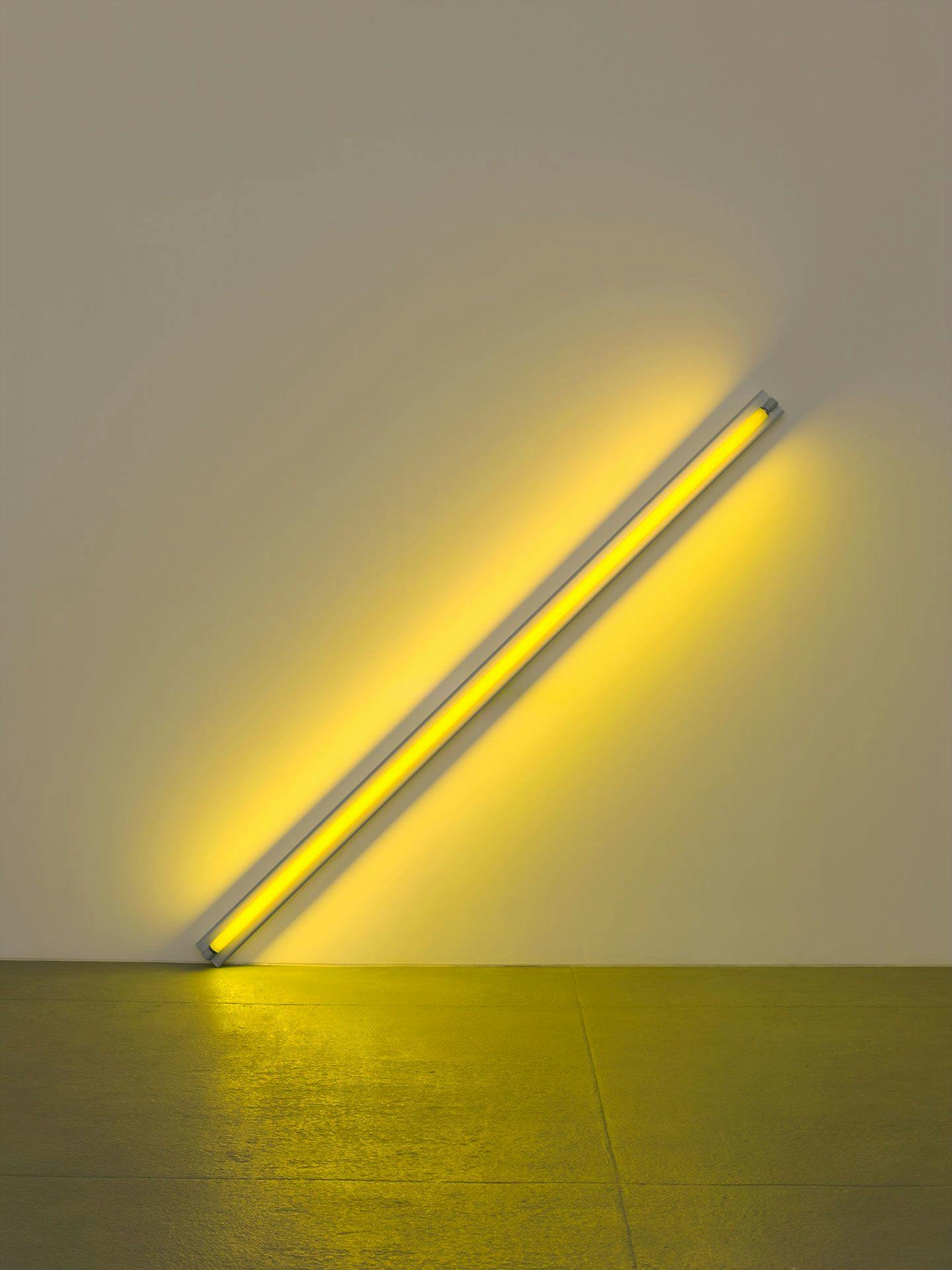 A sculpture in yellow fluorescent light by Dan Flavin, titled the diagonal of May 25, 1963 (to Constantin Brancusi), dated 1963.